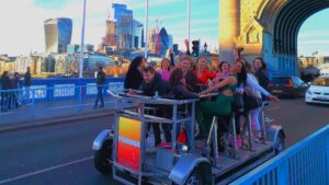 Pedibus Beer Bike with girls having a party on Tower Bridge, London