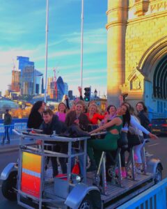 Pedibus Beer Bike with girls having a party on Tower Bridge, London